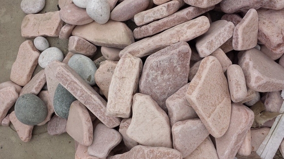 China Pink Sandstone Tumbled Stone Natural Decorative Wall Stone Sandstone Landscaping Floor Stone supplier